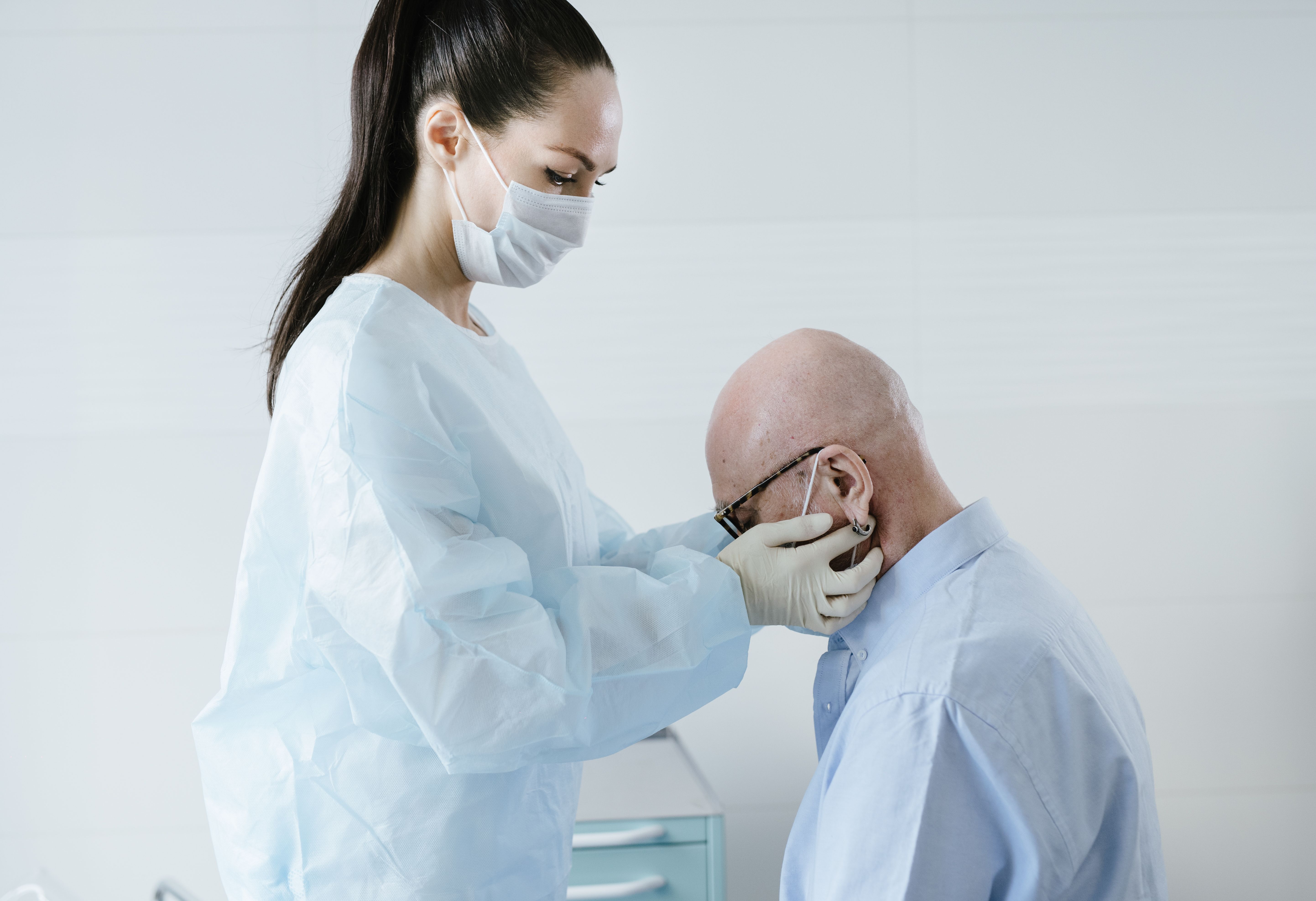 Geriatrician examining an elderly patient